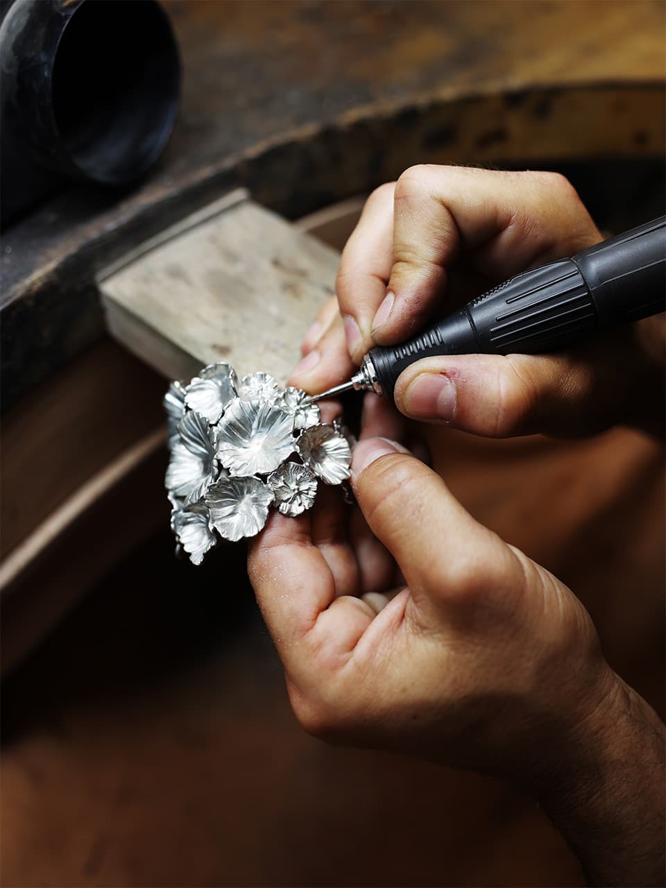Master jeweller hand-crafting a custom engagement ring at the Luster & Co. studio in Vancouver, BC